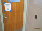 Door with taped-on sign.