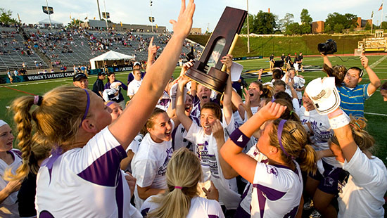 Women's Lacrosse team celebrating victory.