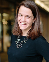 Elizabeth Gerber smiles into the camera.