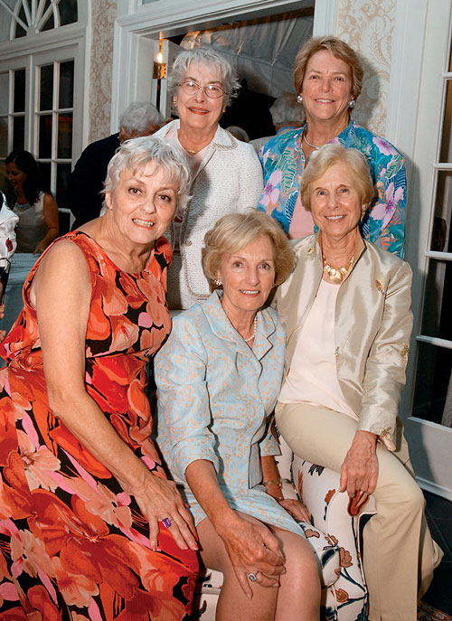 Kappa Kappa Gamma Sorority sisters, seated from left, Corinna Heidbrink Shirk (WCAS56), Shirley Stoup Cobb (WCAS56), Audrey Heinemann Fitzgerald (C56, GC63), and standing, Ann Lindsay Gardner (WCAS56) and Nancy Price Mead (WCAS56)