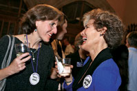Nancy Haar (SESP82) and Maureen Taylor (Mu83) share memories at the 25th-reunion party.