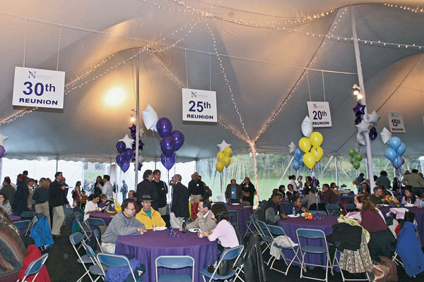 Alumni get reacquainted at the Meadow Madness tent bash.