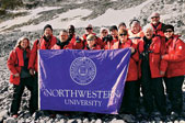 The Northwestern Alumni Association travelers show their school spirit in Antarctica.